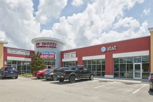 Triple Crown Plaza building parking lot AT&T Dr. Snooze available rpm realty management